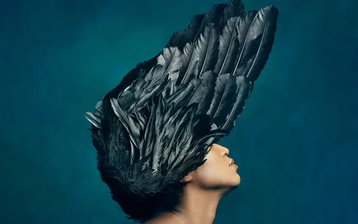 Dutch National Opera promotional image for Semele showing a profile beneath a large black feathered headdress